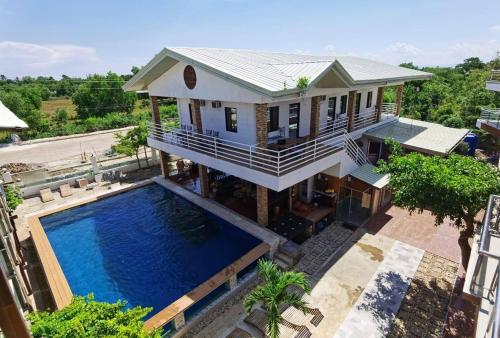 an aerial view of a house with a swimming pool at Amanzara Bohol Resort in Bolod