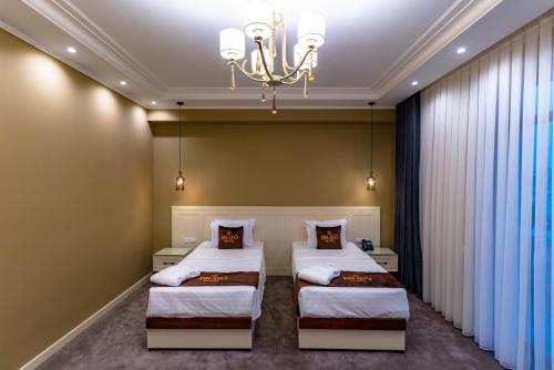 Katil atau katil-katil dalam bilik di Bravo Hotel
