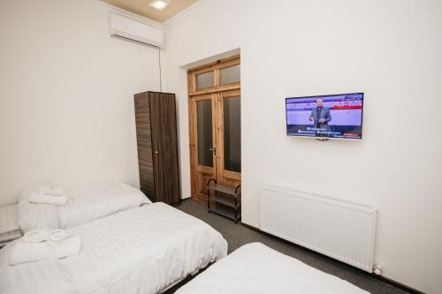 Katil atau katil-katil dalam bilik di Nazarxan Hotel