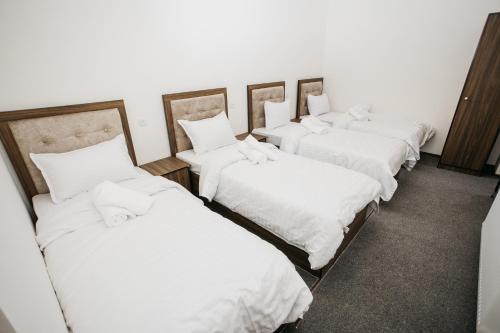 Katil atau katil-katil dalam bilik di Nazarxan Hotel