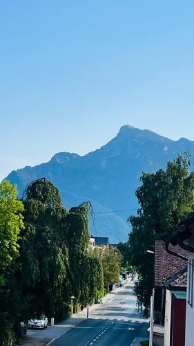 a view of a street with a mountain in the background at Apartment Leo6 in Salzburg