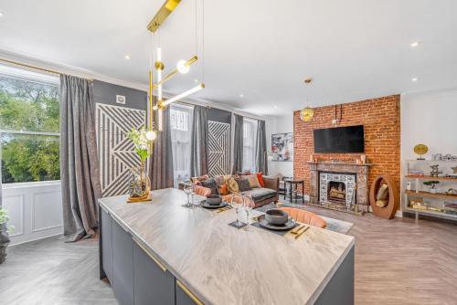a kitchen and living room with a fireplace at Bank Apartments in Boston
