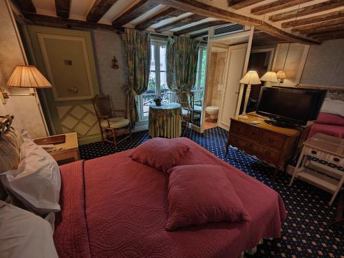 Letto o letti in una camera di Le Relais Médicis