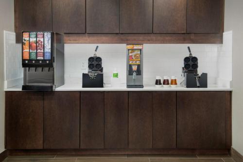 a bar with two computer consoles on a counter at Residence Inn Birmingham Hoover in Hoover