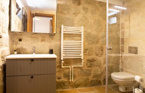 a bathroom with a sink and a toilet and a shower at Stone House w Private Pool and Garden in Bodrum in Ortakent