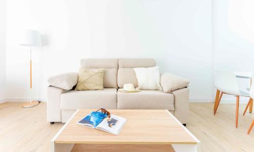 a living room with a couch and a coffee table at Ona Alborada in Costa Del Silencio