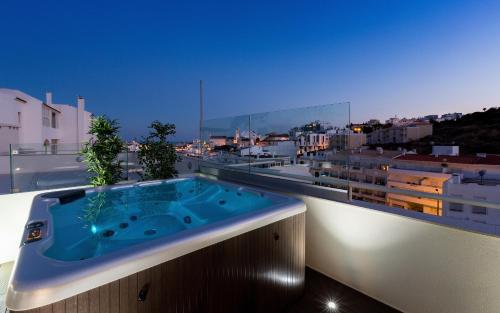 a bath tub sitting on top of a building at D_Loft Downtown in Albufeira