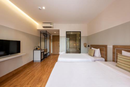 Ein Bett oder Betten in einem Zimmer der Unterkunft Hami Garden - Authentic & Natural Resort