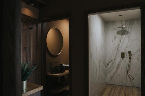a bathroom with a sink and a mirror on the wall at Apartmaji Mara in Ribnica na Pohorju