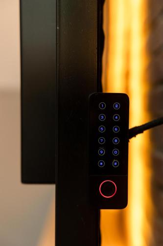 a close up of a remote control on a door at Valaoritou 3 Luxury Rooms in Thessaloniki