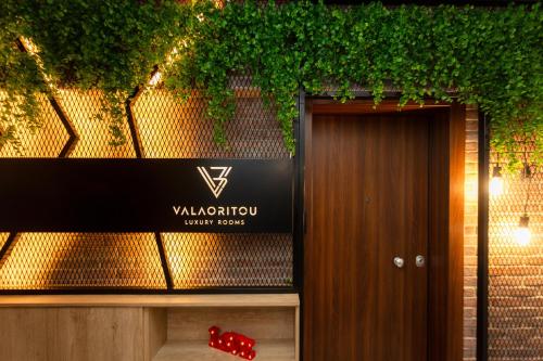 a red dice sitting next to a wooden door at Valaoritou 3 Luxury Rooms in Thessaloniki