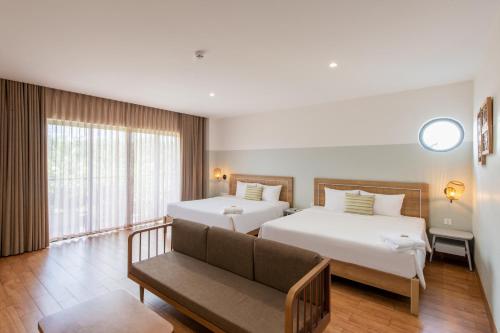 Ein Bett oder Betten in einem Zimmer der Unterkunft Hami Garden - Authentic & Natural Resort