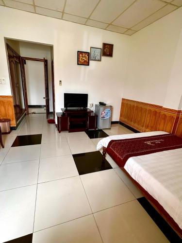 TV a/nebo společenská místnost v ubytování Trúc Hoàng Hà Hotel