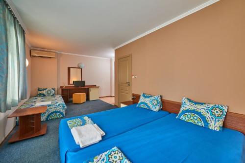 Postel nebo postele na pokoji v ubytování Family Hotel Electra