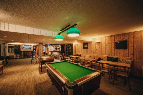 a billiard room with a pool table in it at Résidence Capfun du Téléphérique, Morzine in Morzine