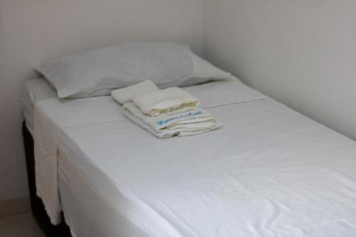 Un ou plusieurs lits dans un hébergement de l'établissement Hotel Porto da Lua Belém