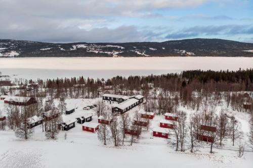 an aerial view of a train station in the snow at Hyttgårdens stugby i Huså, Åre kommun in Huså