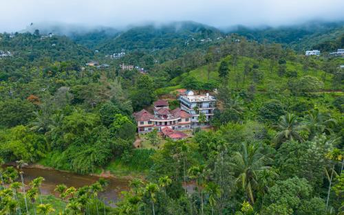 an aerial view of a house in the forest at Misty Heights by The Sanihara in Vayittiri