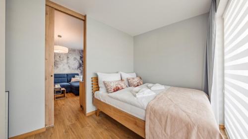 Ένα ή περισσότερα κρεβάτια σε δωμάτιο στο Apartament Sutileza 9 C - Perłowa Przystań Holiday City