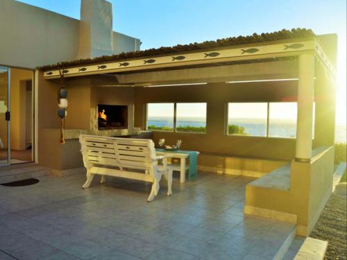 a bench on a patio with a view of the ocean at Peaceful Place in Port Nolloth