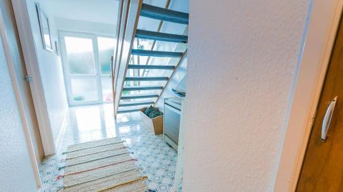 a staircase in a house with a stair case at Pencoed in Llanbedrog