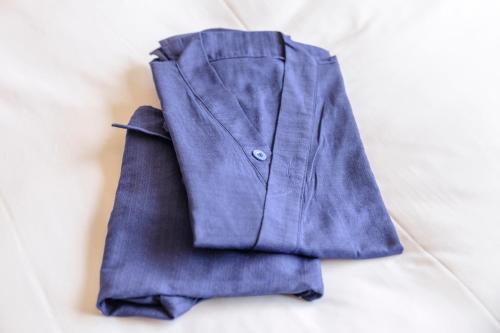 a purple jacket sitting on top of a table at Tosei Hotel Cocone Tsukiji Ginza Premier in Tokyo