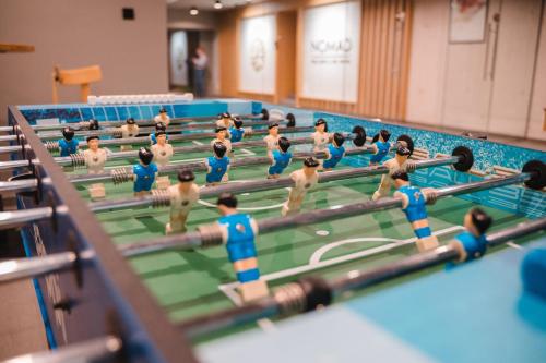 a model of a swimming pool with dolls of people at Hotel Nomad in Bjelašnica