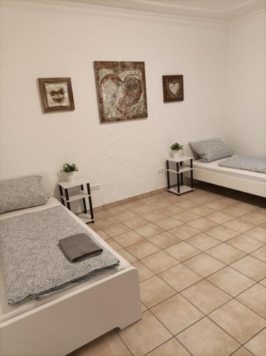 Ένα ή περισσότερα κρεβάτια σε δωμάτιο στο Gaststätte Neumann