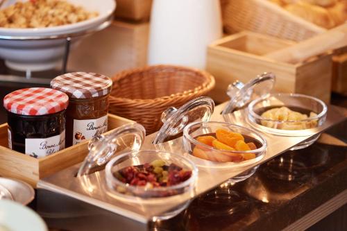 a buffet with several bowls of food on a table at Tosei Hotel Cocone Tsukiji Ginza Premier in Tokyo