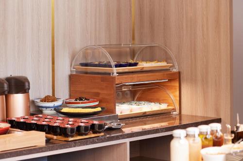 a buffet with various food items on a counter at Tosei Hotel Cocone Tsukiji Ginza Premier in Tokyo