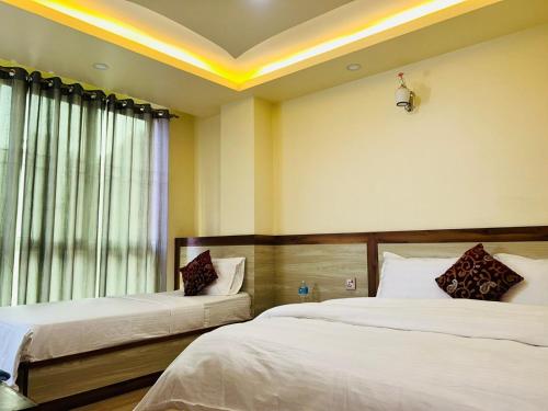 Postel nebo postele na pokoji v ubytování Hotel Balgopal