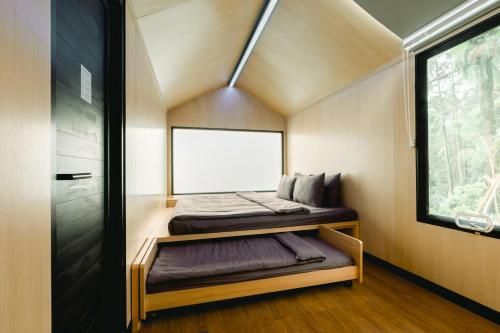 a small room with two beds in a tiny house at Bobocabin Gunung Rinjani, Lombok in Sembalun Lawang
