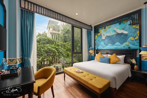 a bedroom with a bed and a large window at Eliana Signature Hanoi Hotel in Hanoi