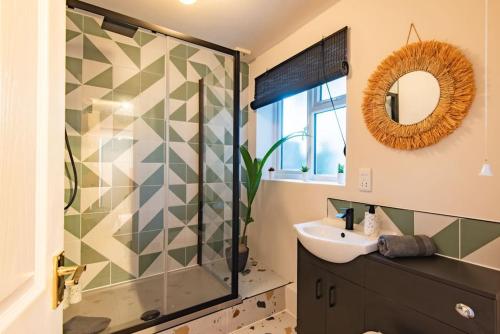 a bathroom with a shower and a sink at The Courtyard in Folkestone