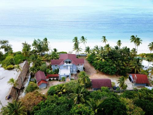 an aerial view of a house on the beach at Villa Oman in Bwejuu
