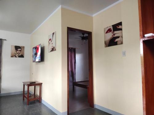 a room with a hallway with pictures on the walls at Garden Village Resort in Moalboal