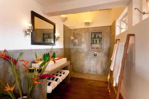 a bathroom with a sink and a mirror at A 03 Bedroom Villa in Galle Fort with Roof Terrace & Pool in Galle