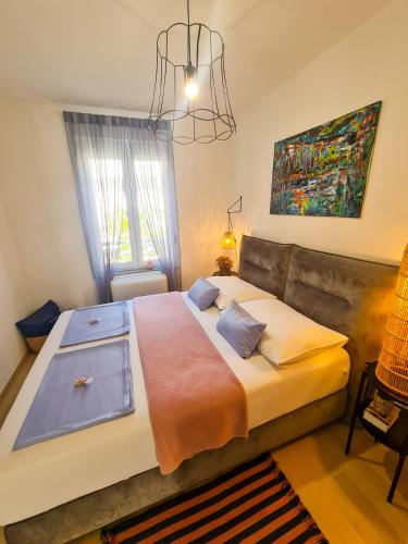 a bedroom with a large bed in a room at Apartment TORRE - NEW in Senj
