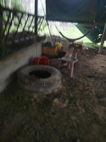 a room with a large tire and a tent at พัทลุง 