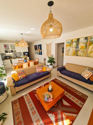 a living room with two couches and a table at Apartment TORRE - NEW in Senj