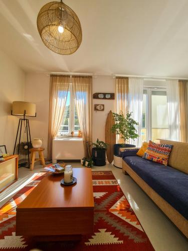 a living room with a couch and a coffee table at Apartment TORRE - NEW in Senj