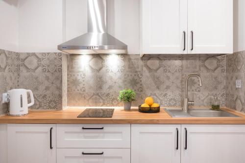 Kuchyňa alebo kuchynka v ubytovaní AtHome Toruń Apartamenty
