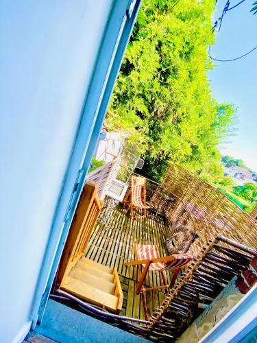 a view of a patio with chairs and a table at Hôtel VCB Ciney Centre-ville in Ciney