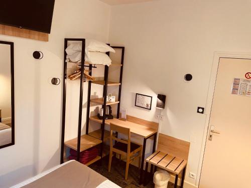 Ein Bett oder Betten in einem Zimmer der Unterkunft Logis Le Passiflore Cognac