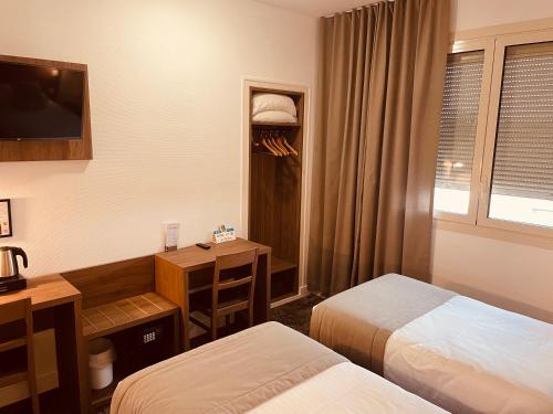 Ein Bett oder Betten in einem Zimmer der Unterkunft Logis Le Passiflore Cognac