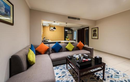 a living room with two couches and a table at Boudl Abha in Abha