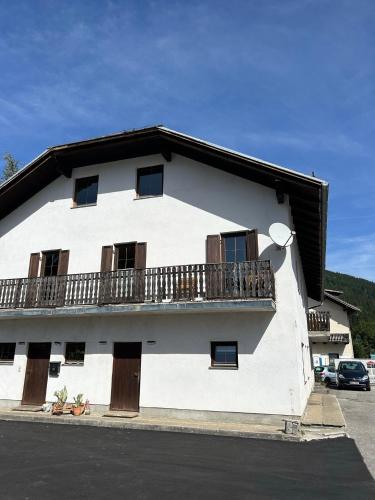 a white building with a balcony on the side of it at Tina a Petr , Lunz am See in Lunz am See