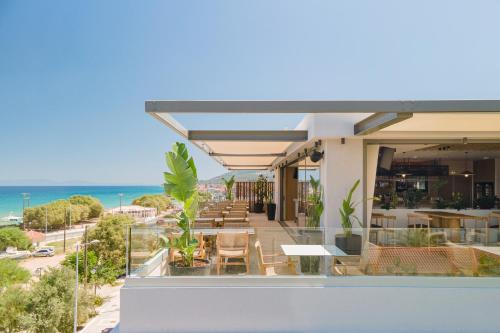 a view of the beach from the balcony of a hotel at Erato by Samian Mare in Karlovasi