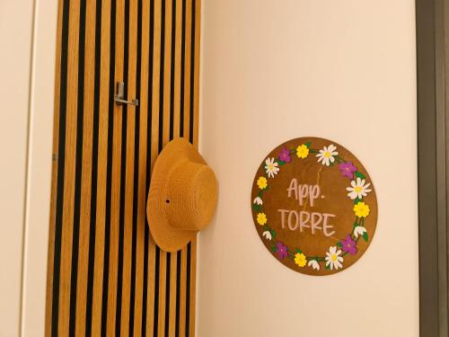 a hat on a door with a sign that says hope at Apartment TORRE - NEW in Senj