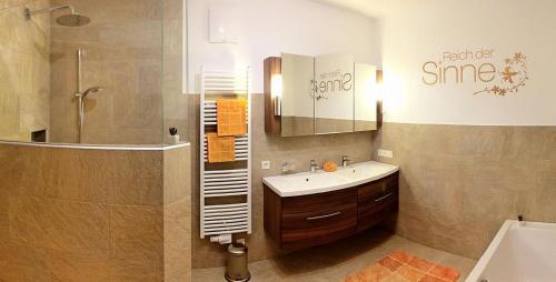 a bathroom with a sink and a shower at Ferienwohnung Natural A in Gerlosberg